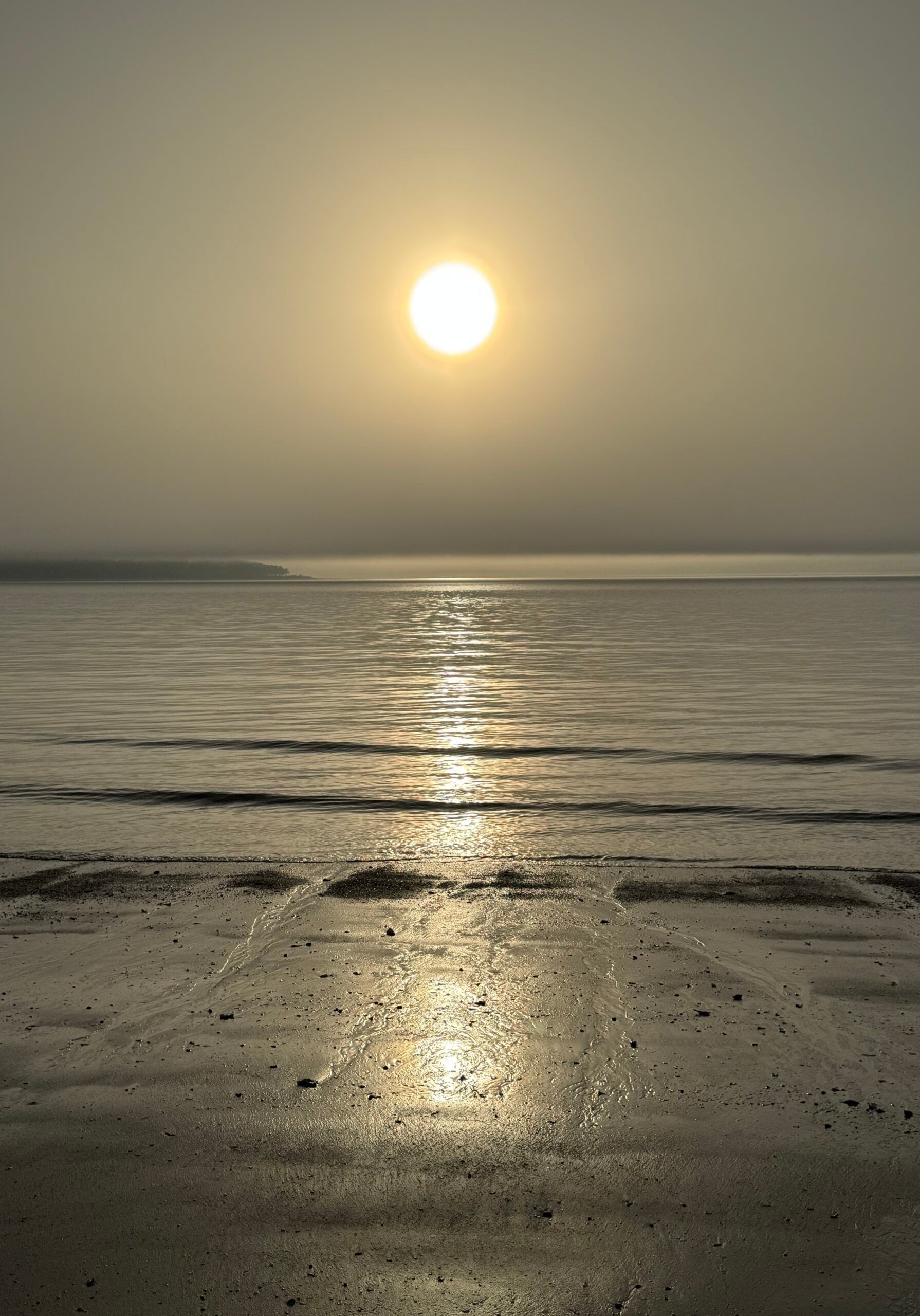 The sun is setting over a body of water