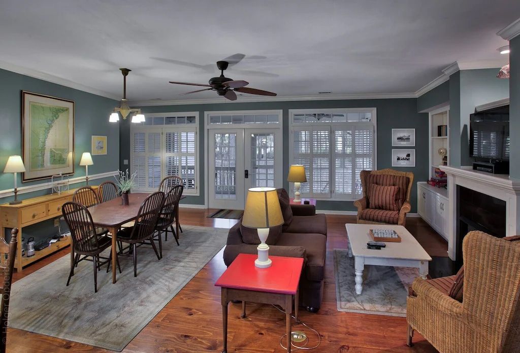 A living room filled with furniture and a ceiling fan