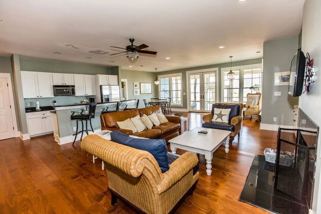 A living room filled with furniture and a fireplace.