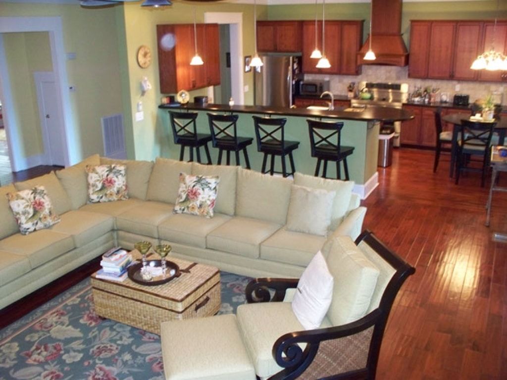 A living room with a sectional couch and a coffee table