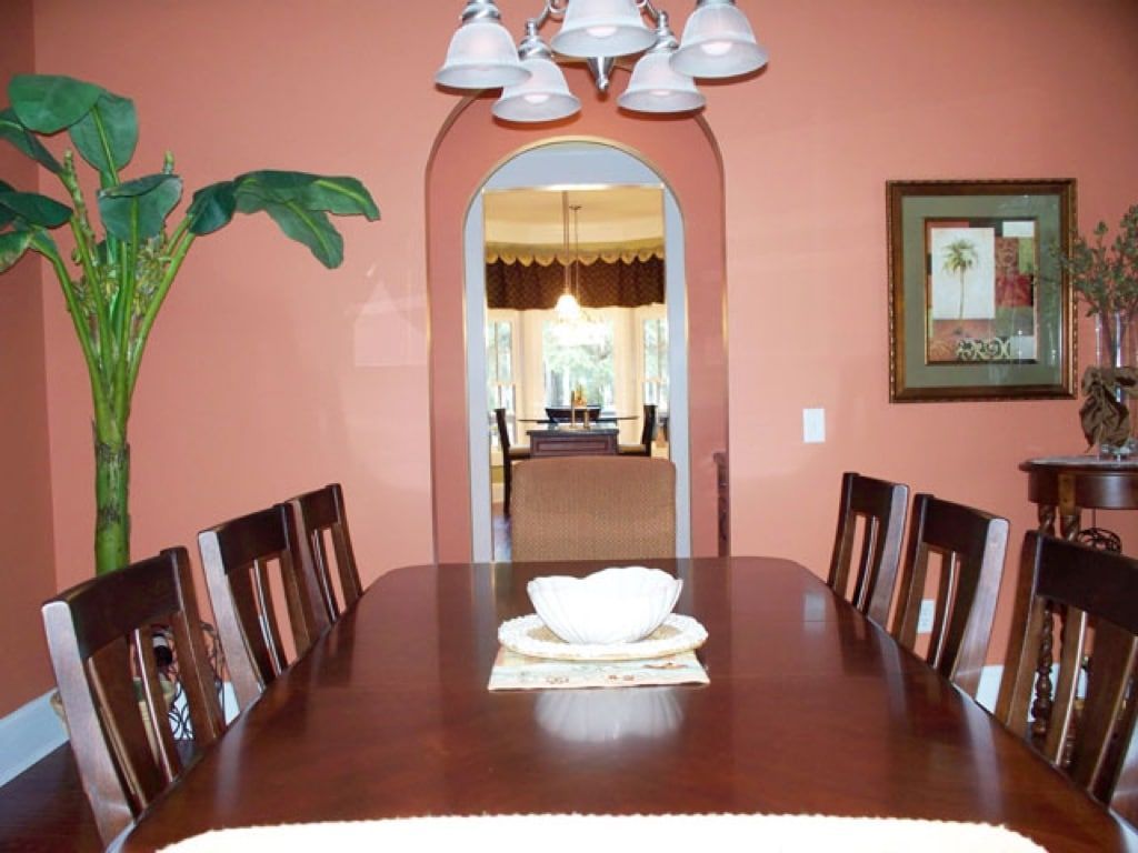 A dining room table with a bowl on it