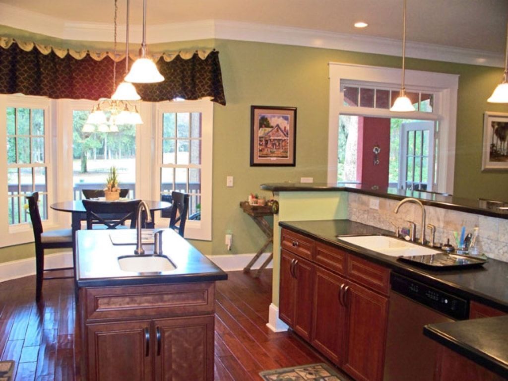 A kitchen with a large island and a sink