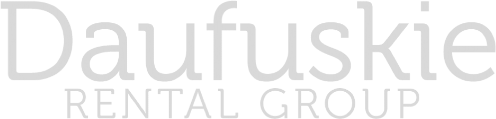 A white logo for daufuskie rental group on a white background.