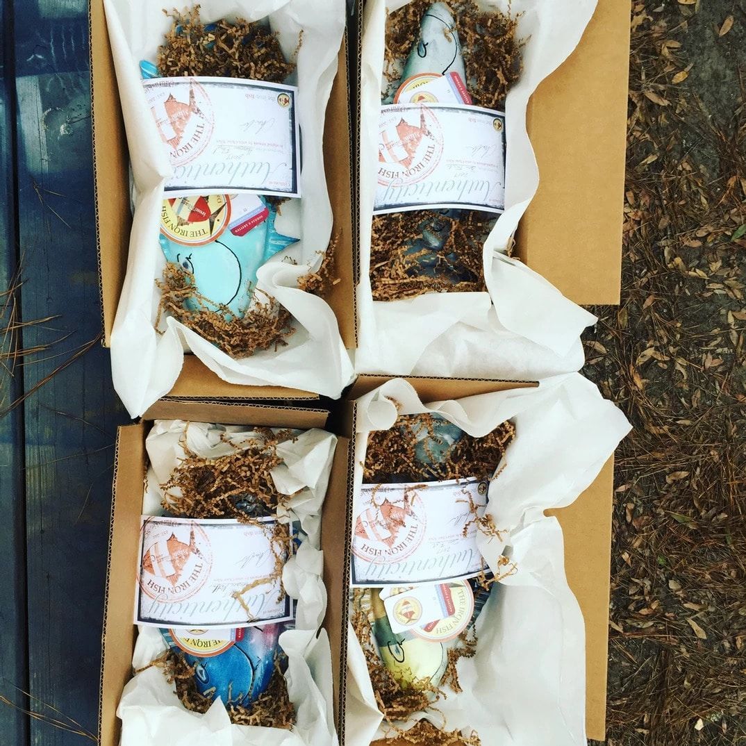 Four boxes of easter eggs are wrapped in white paper