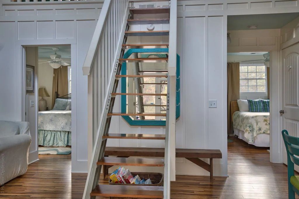 A wooden staircase leading up to the second floor of a house.