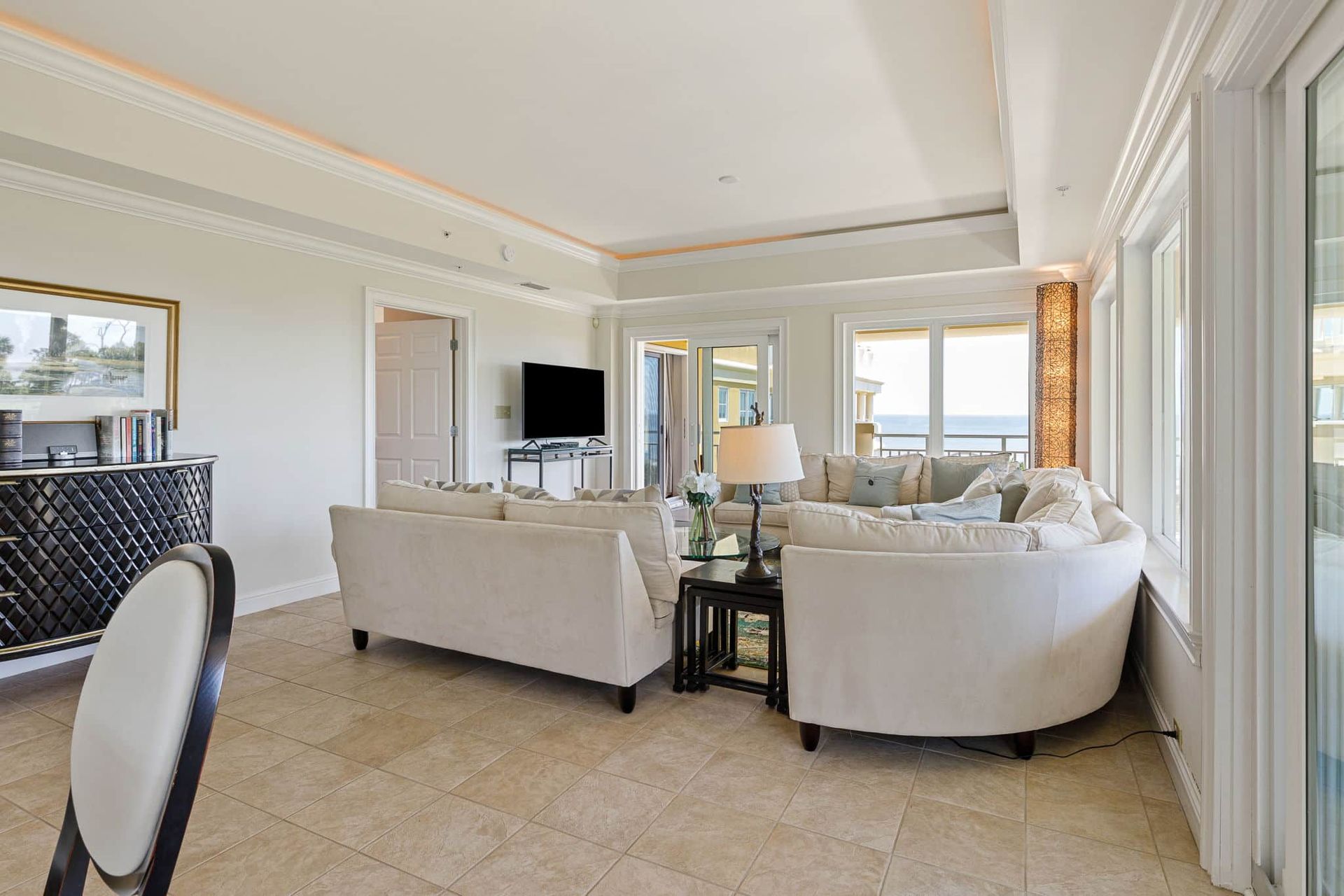 A living room filled with furniture and a television.
