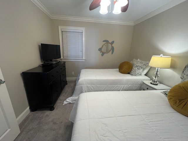 A kitchen with stainless steel appliances and white cabinets.