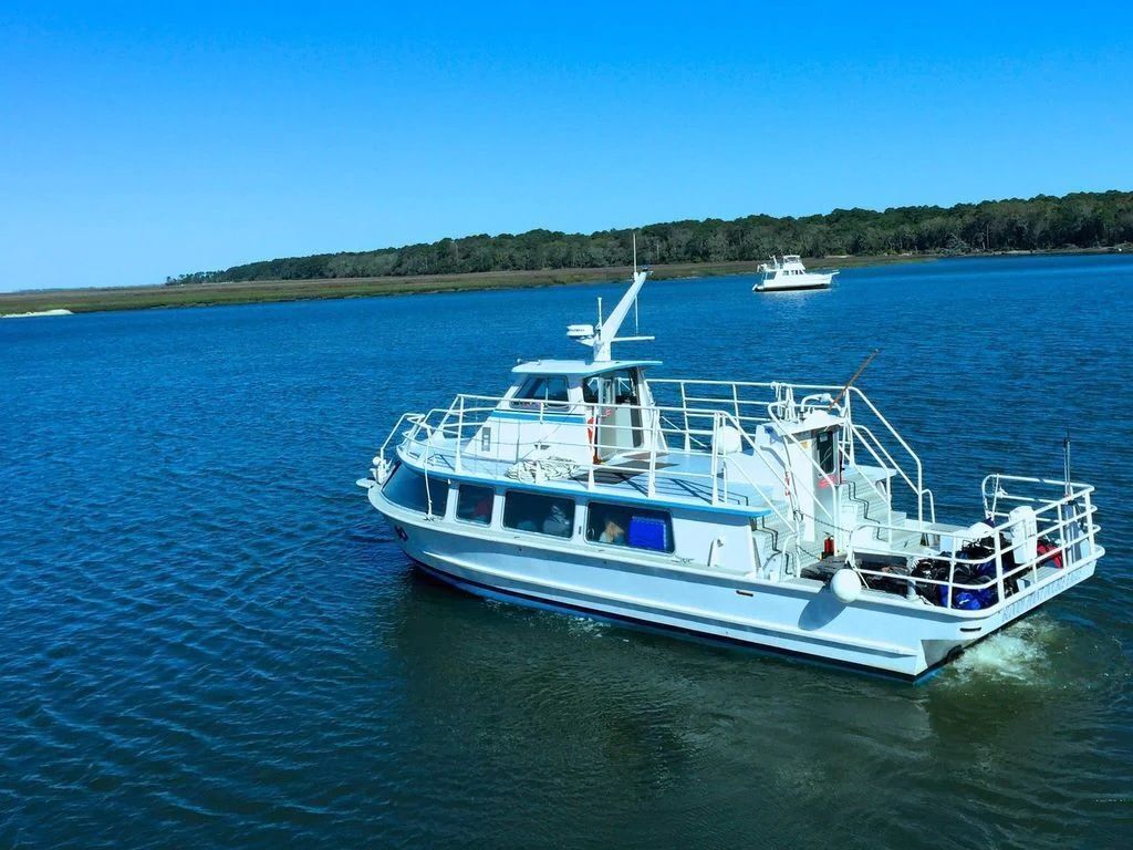A boat is floating on top of a body of water.