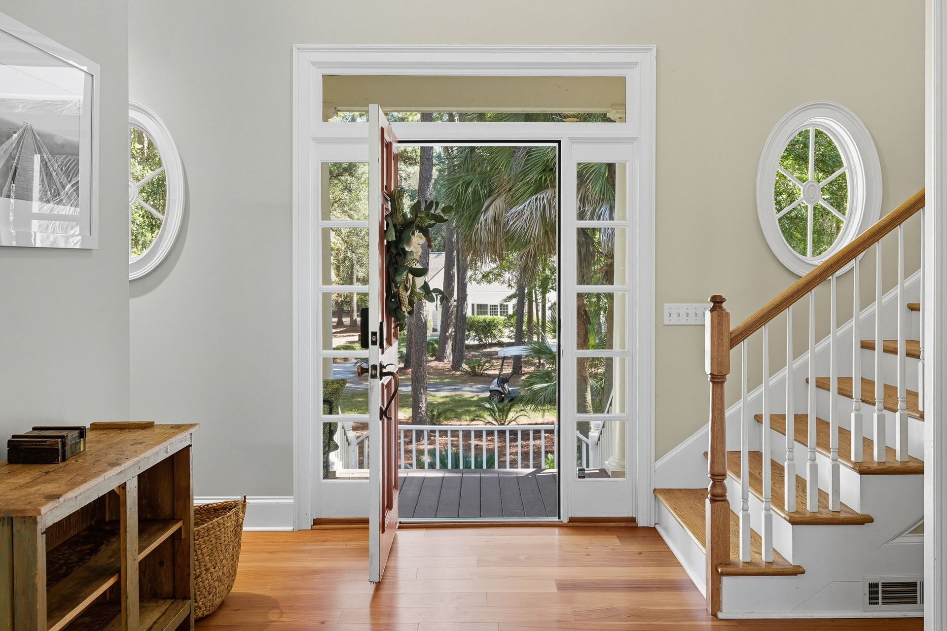 A living room with a couch , chair , fireplace and television.