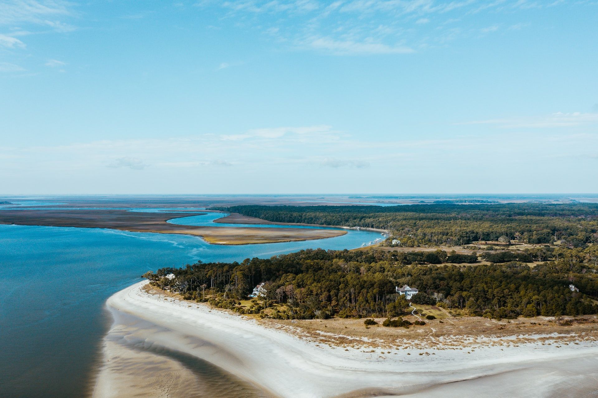 An aerial view of a small island in the middle of a body of water.