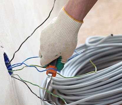 Worker Puts the Wires in the Wall — West Maryland — Brandenburg Electric Inc