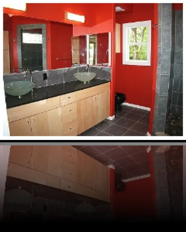 A bathroom with two sinks and two mirrors