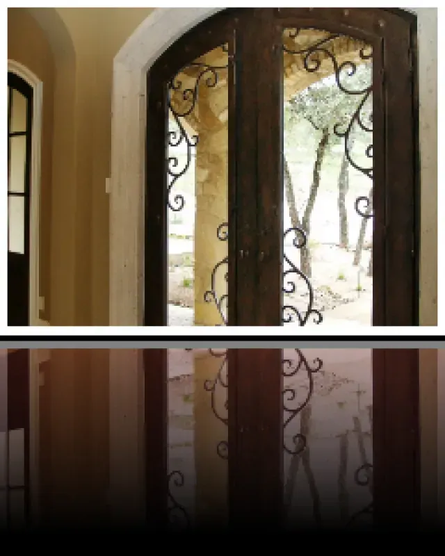 A picture of a door with a wrought iron design on it