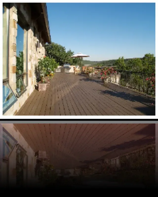 A wooden deck with a view of trees and mountains