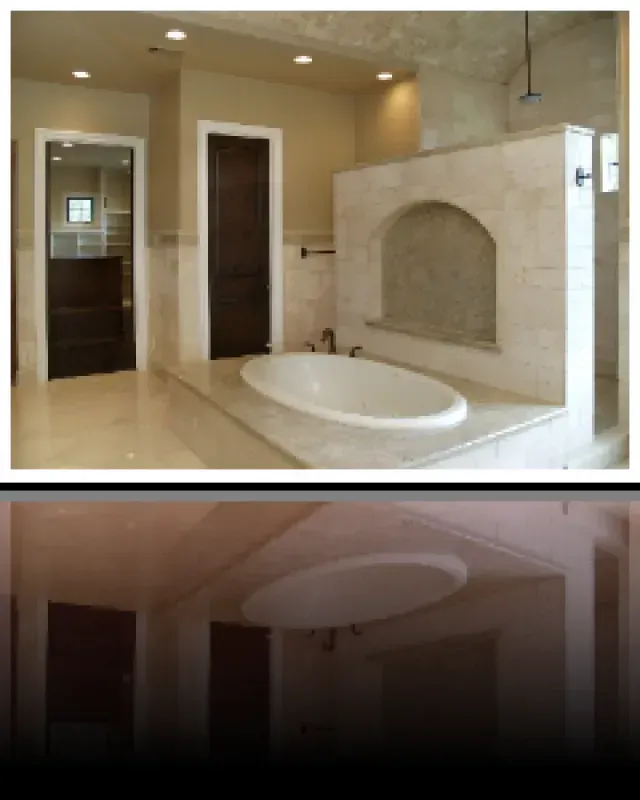 A bathroom with a bathtub and a shower