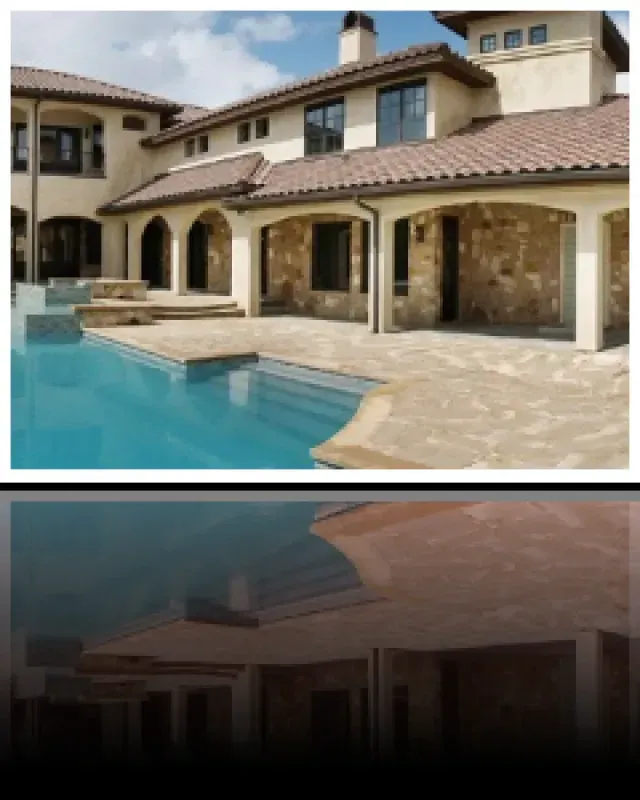 A large house with a swimming pool in front of it
