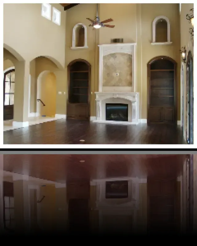 A living room with a fireplace and a ceiling fan
