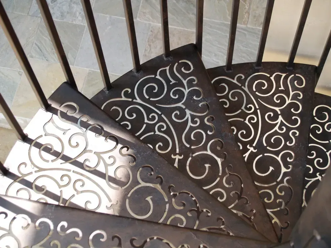 A spiral staircase with a pattern on the steps