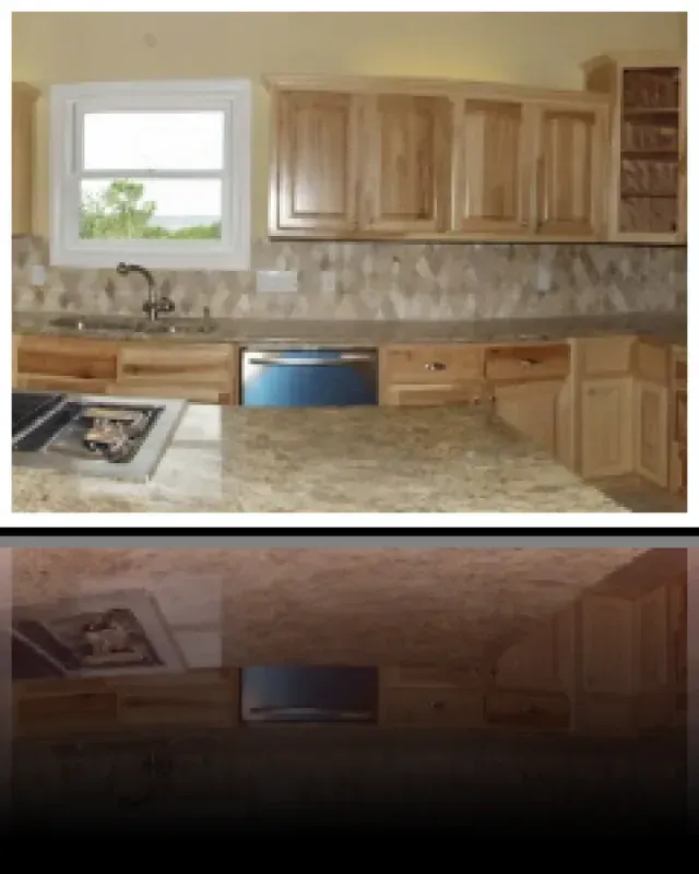 A kitchen with wooden cabinets and granite counter tops