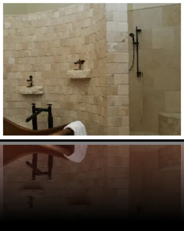 A bathroom with a bathtub and a shower