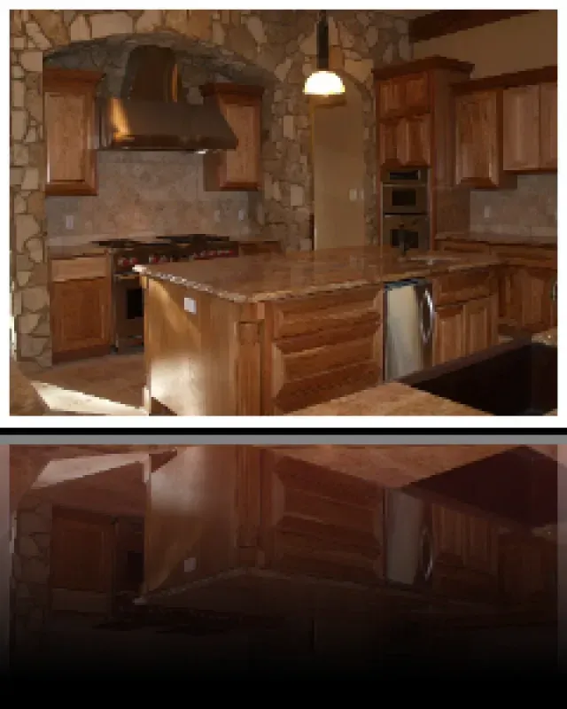 A kitchen with wooden cabinets and granite counter tops