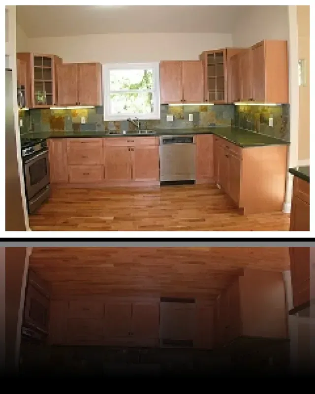 A kitchen with wooden cabinets and stainless steel appliances