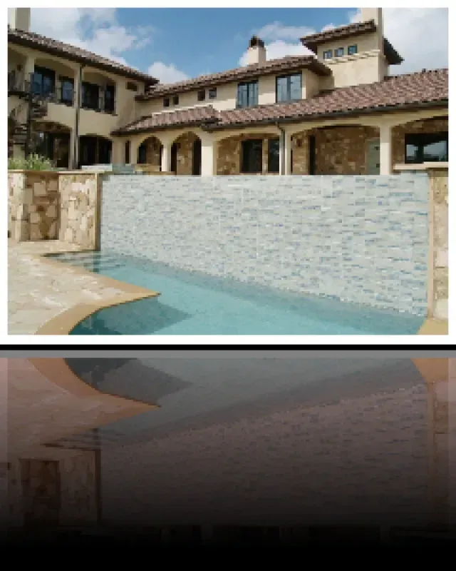 A large house with a swimming pool in front of it