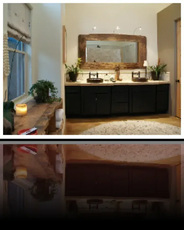 A bathroom with two sinks and a large mirror