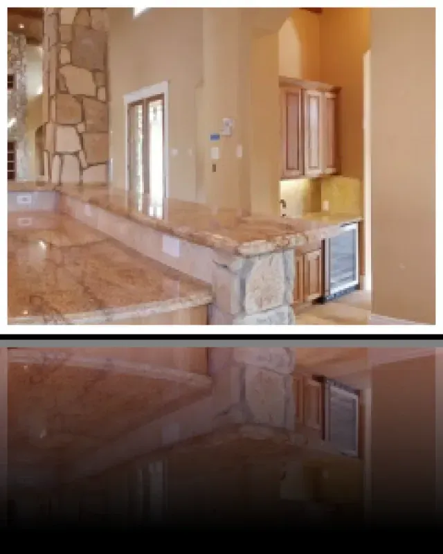 A picture of a kitchen with granite counter tops and cabinets