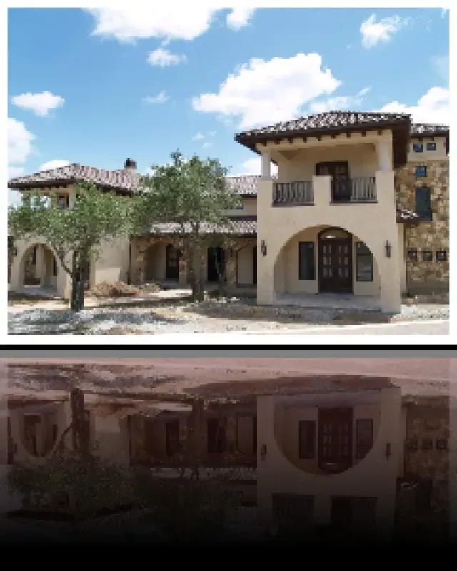 A picture of a house with a balcony and trees in front of it
