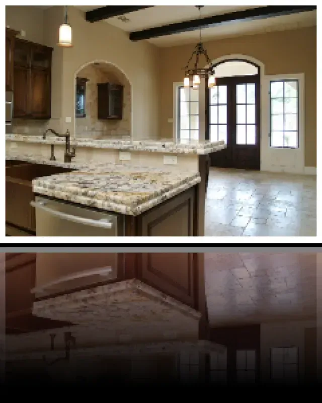 A kitchen with granite counter tops and a dishwasher