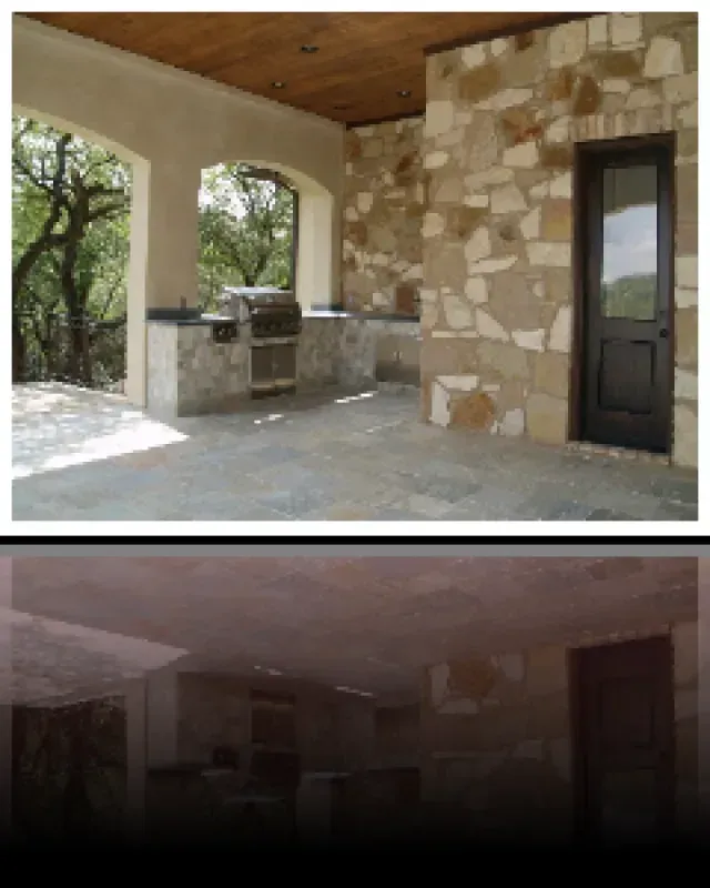 A picture of a porch with a grill and a door
