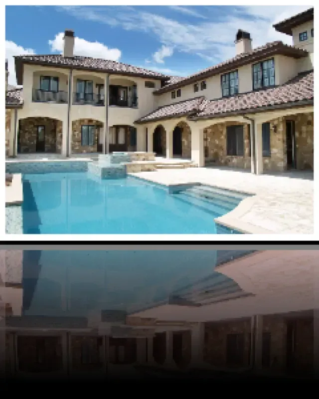 A large house with a large swimming pool in front of it