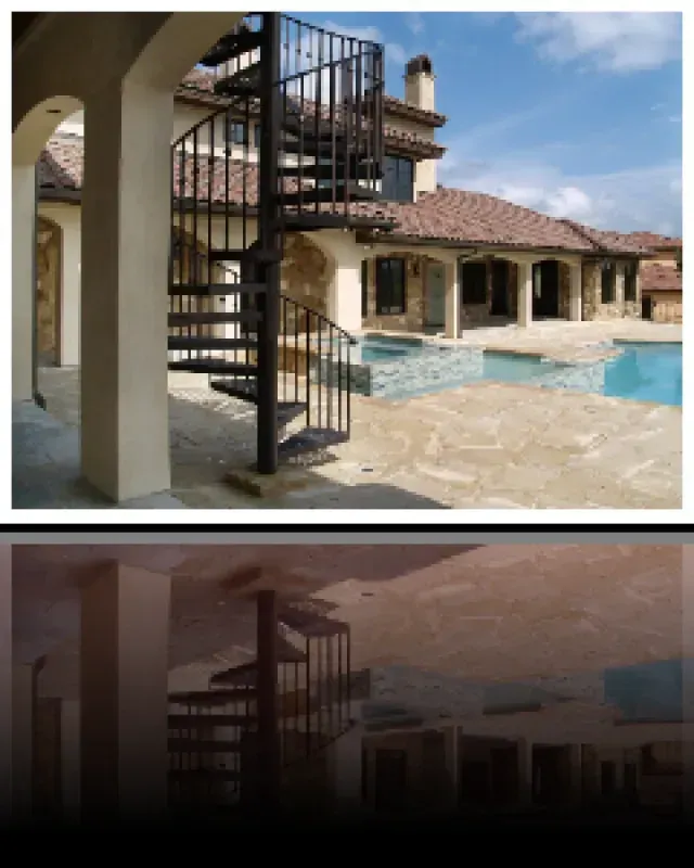 A house with a spiral staircase and a pool