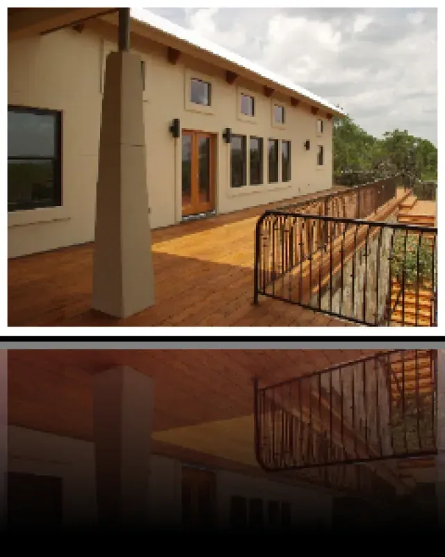 A picture of a house with a balcony and stairs