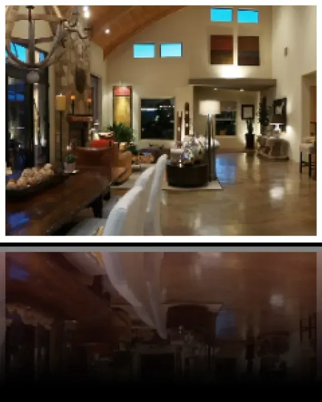 A picture of a living room with a table and chairs