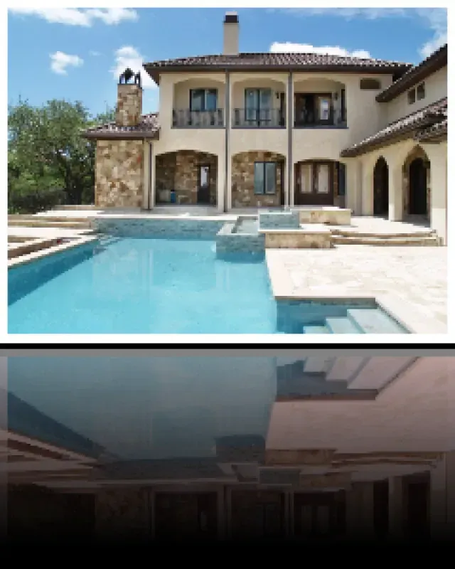 A large house with a large swimming pool in front of it