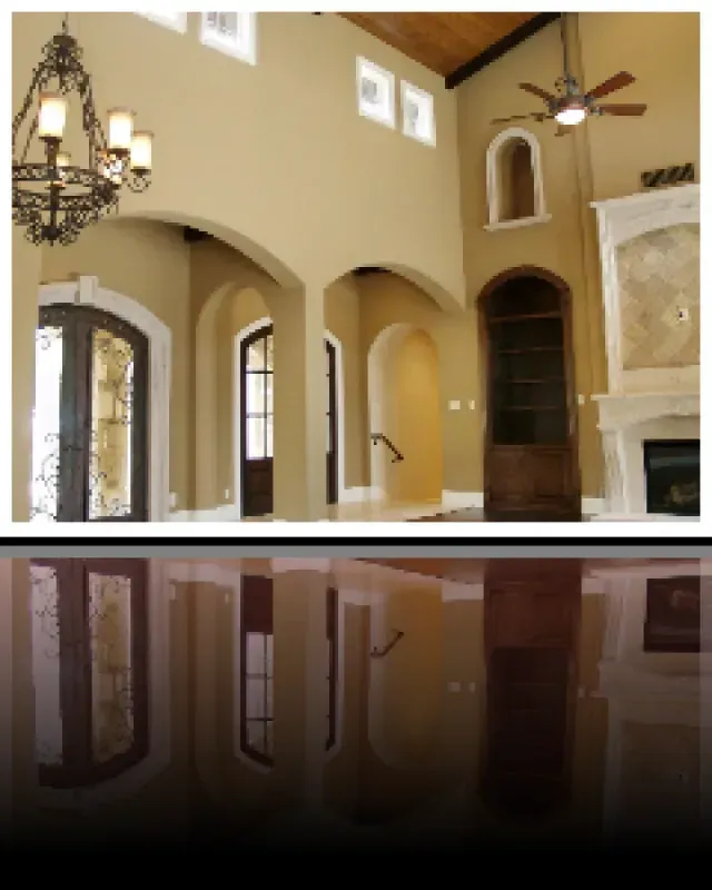 A living room with arches and a ceiling fan