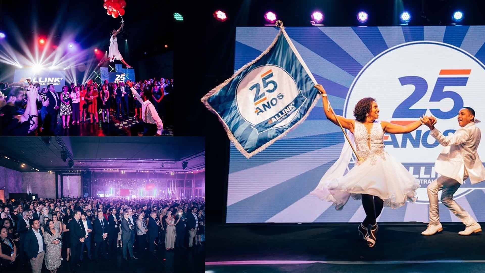 A group of people are dancing in front of a large screen with the number 25 on it.