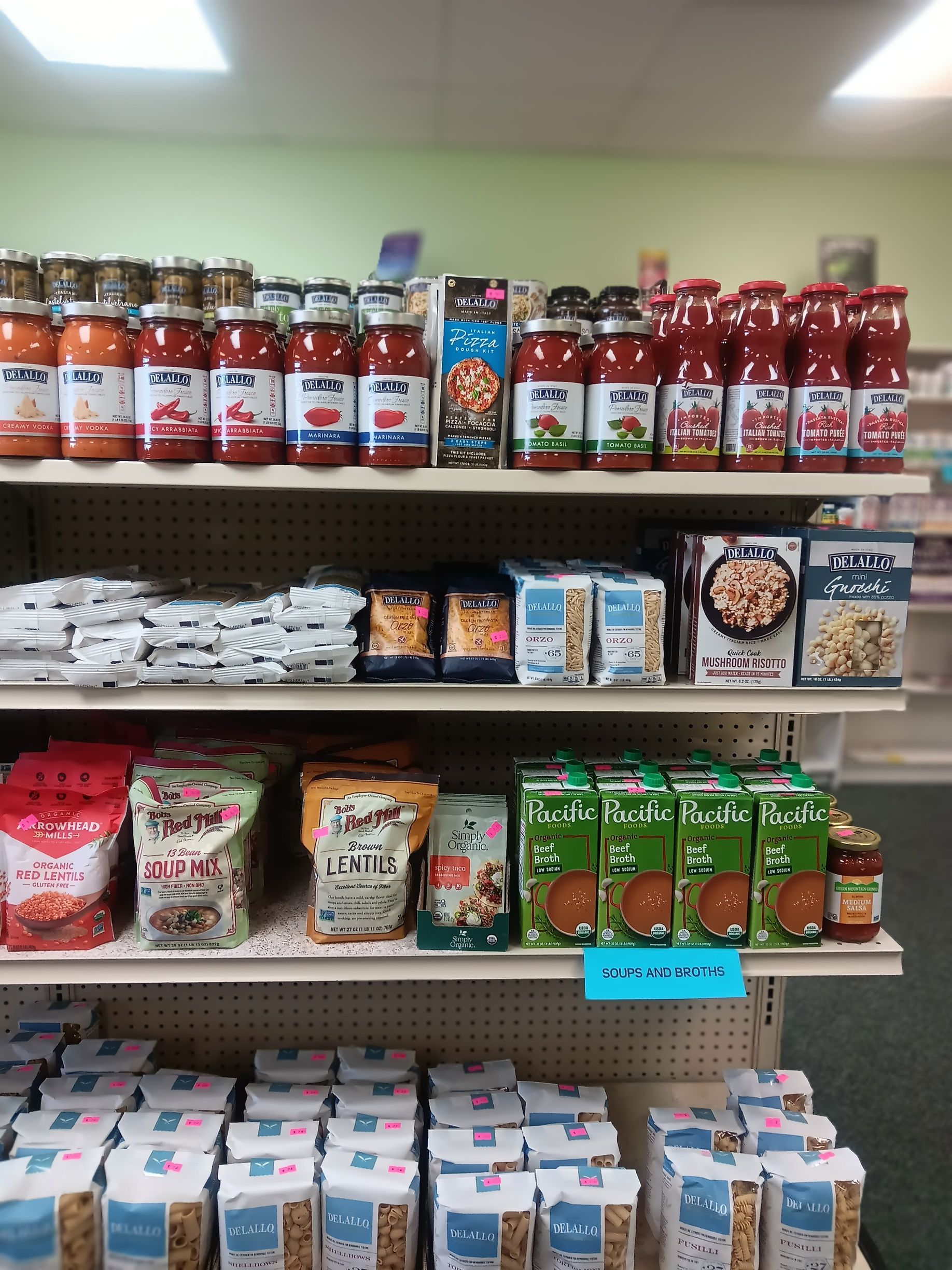 A grocery store shelf filled with a variety of food items.