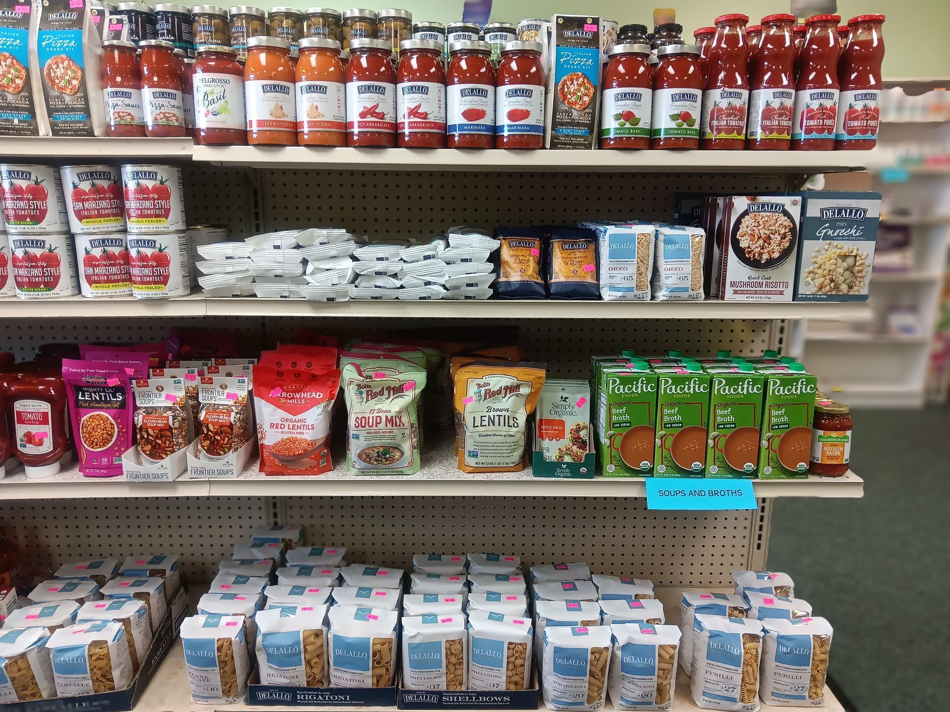 A grocery store shelf filled with lots of food items.