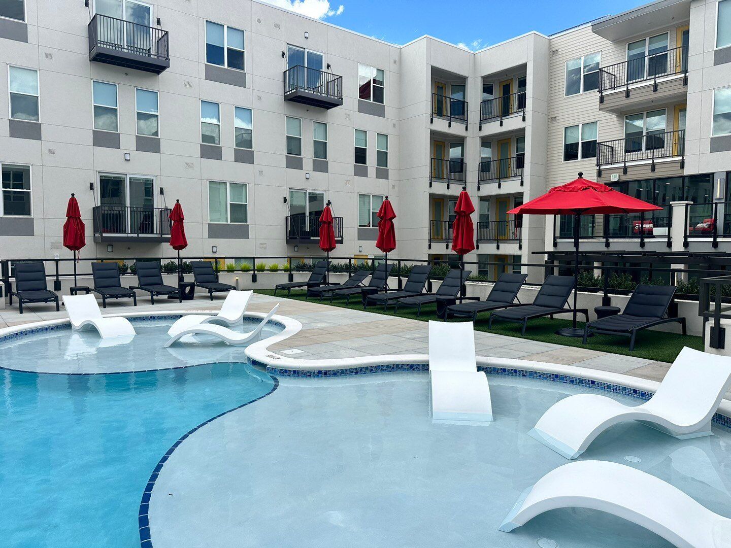 An artist 's impression of a large apartment building with a blue sky in the background at The Experience at Epicenter