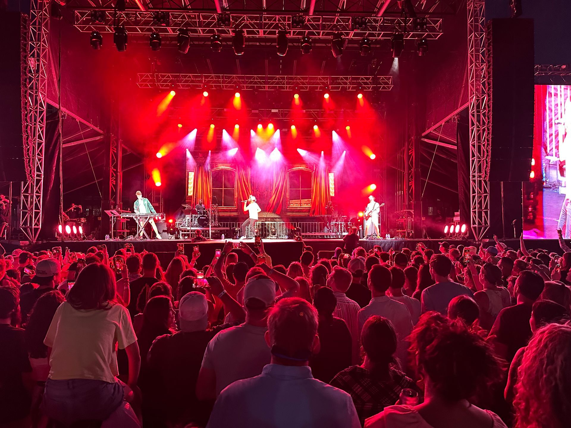 A crowd of people are watching a band on stage at a concert at The Epicenter