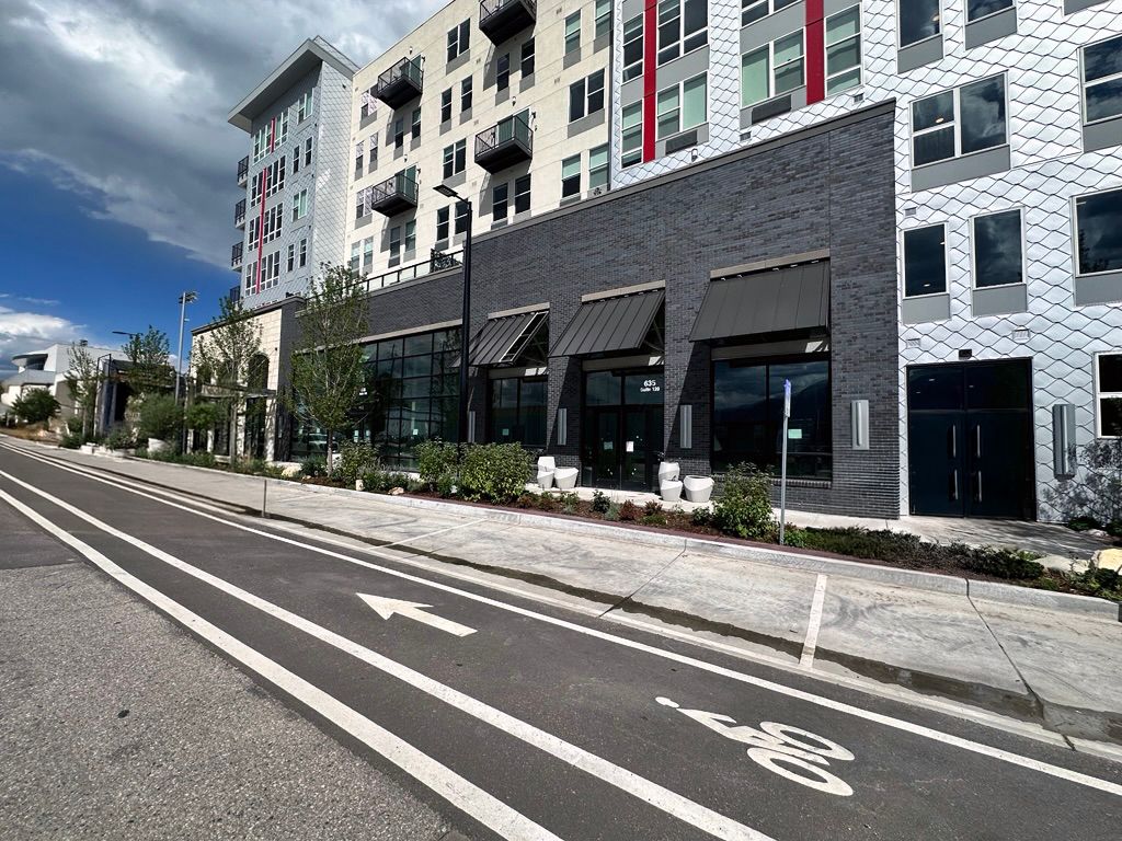 A crowd of people are watching a band on stage at a concert at The Experience at Epicenter