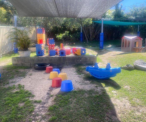 Colourful Outdoor Toys — Stepping Stones Preschool & Child Care Centre in Urunga, NSW