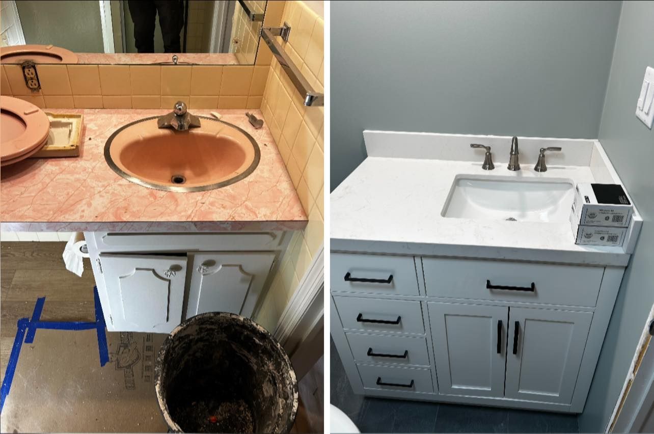 A plumber is fixing a sink in a bathroom.