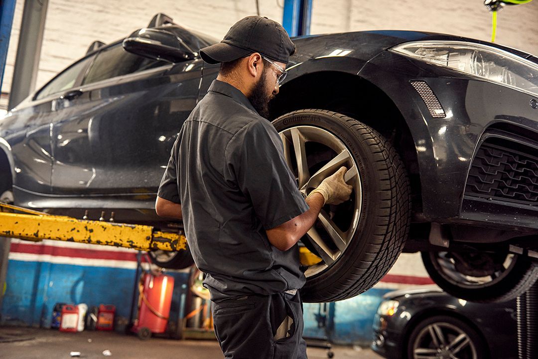 Professional mechanic working on a car engine