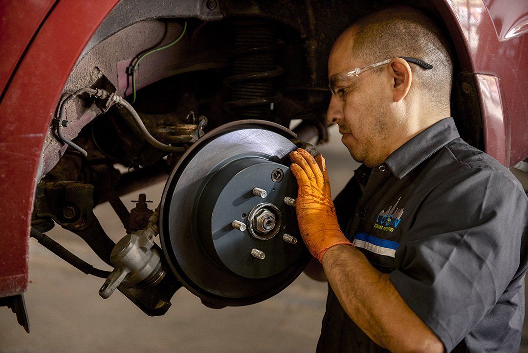 Professional mechanic working on a car engine