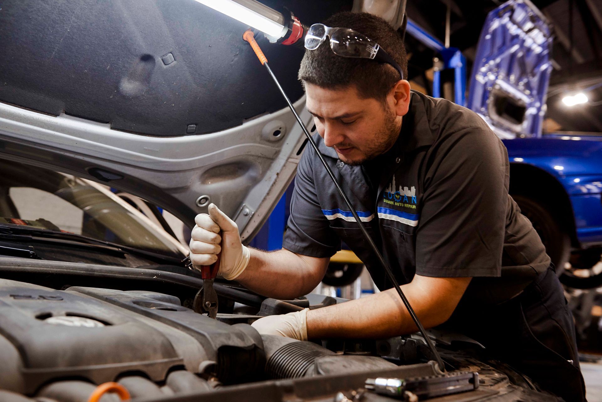 Professional mechanic working on a car engine