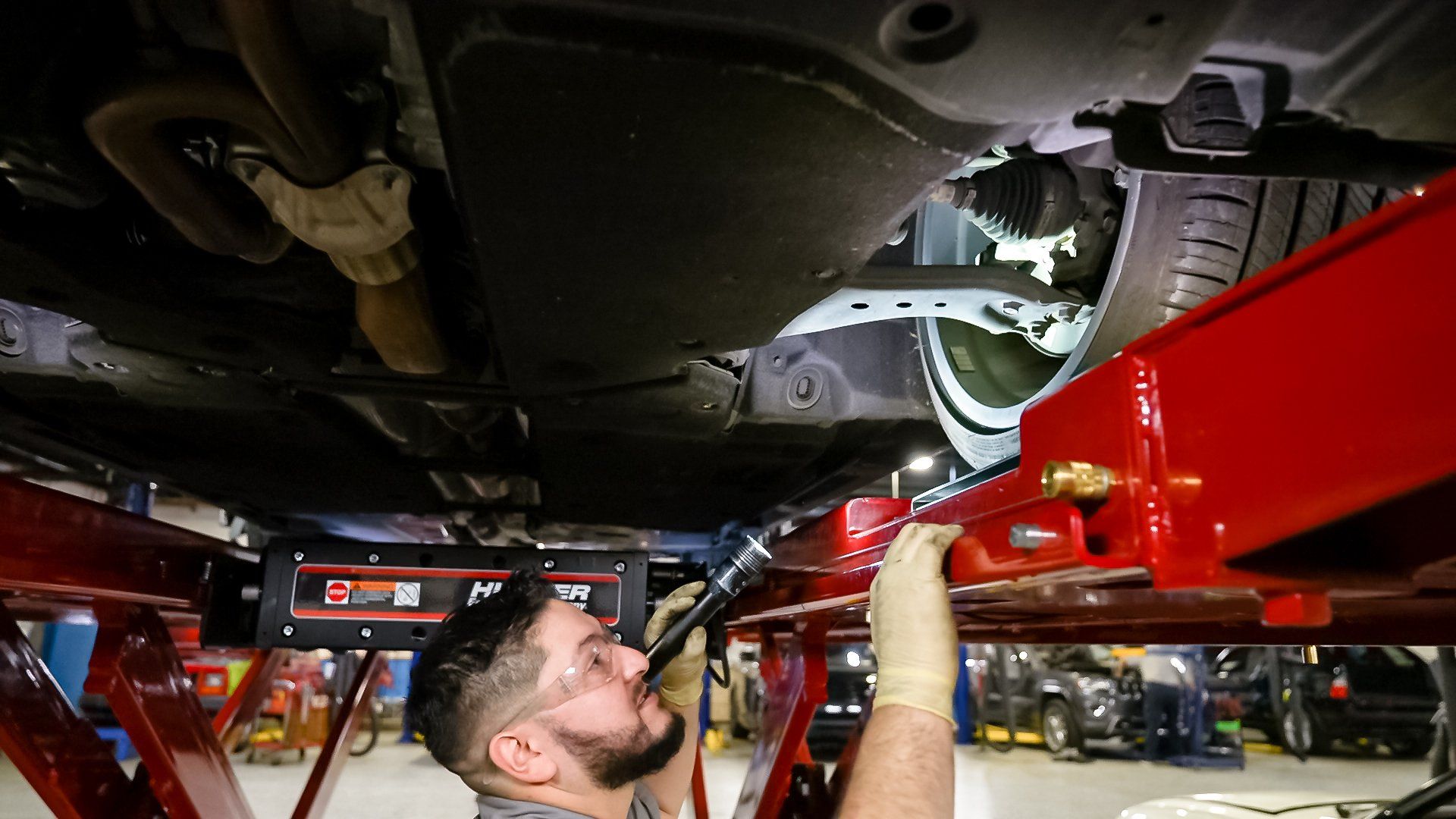 Professional mechanic working on a car engine